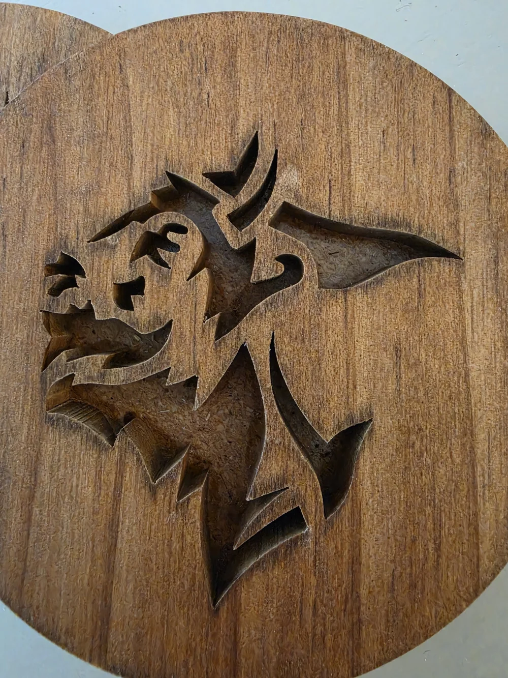 Custom carved wooden drink coaster featuring stylized Buffalo Bison silhouette